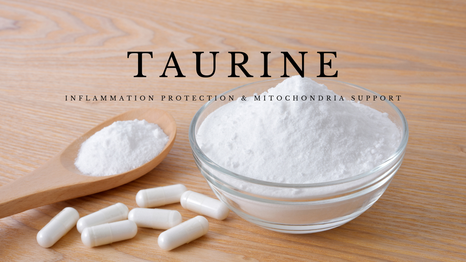 taurine powder and capsules on a wooden table